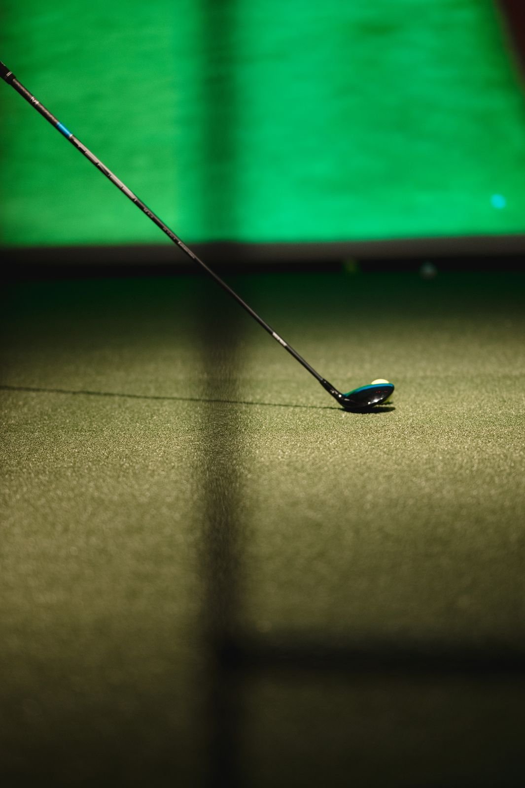 A driver at impact on a simulator mat