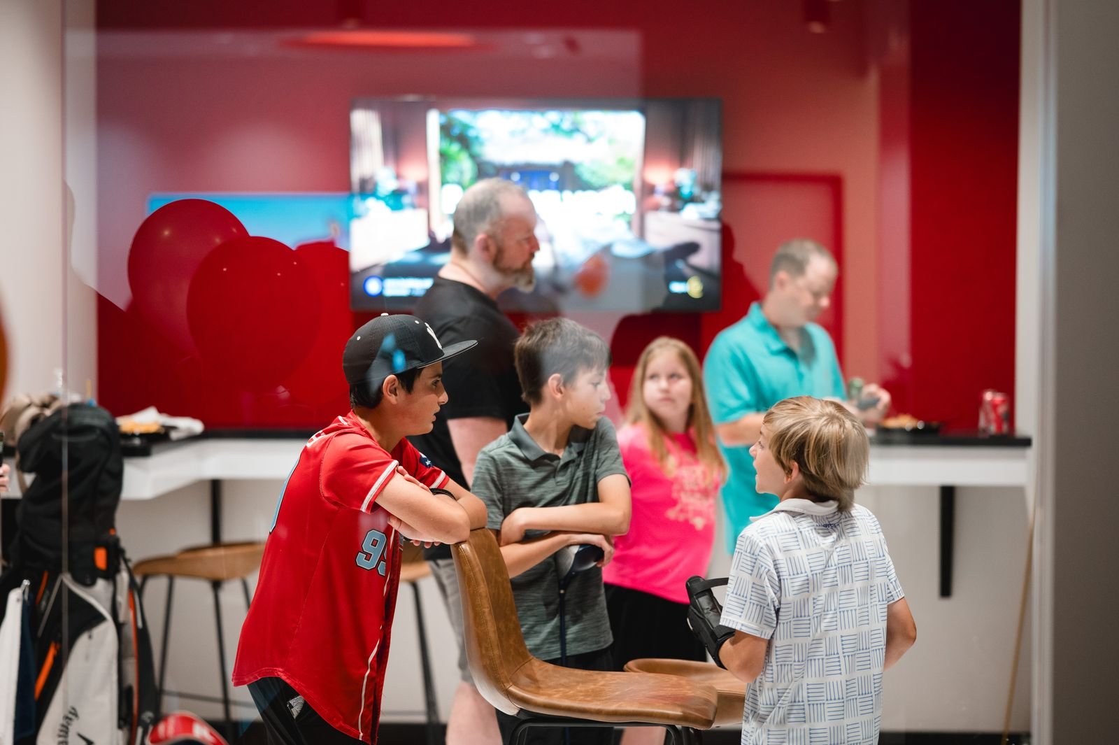 Families gathered at the bar counter of a private suite