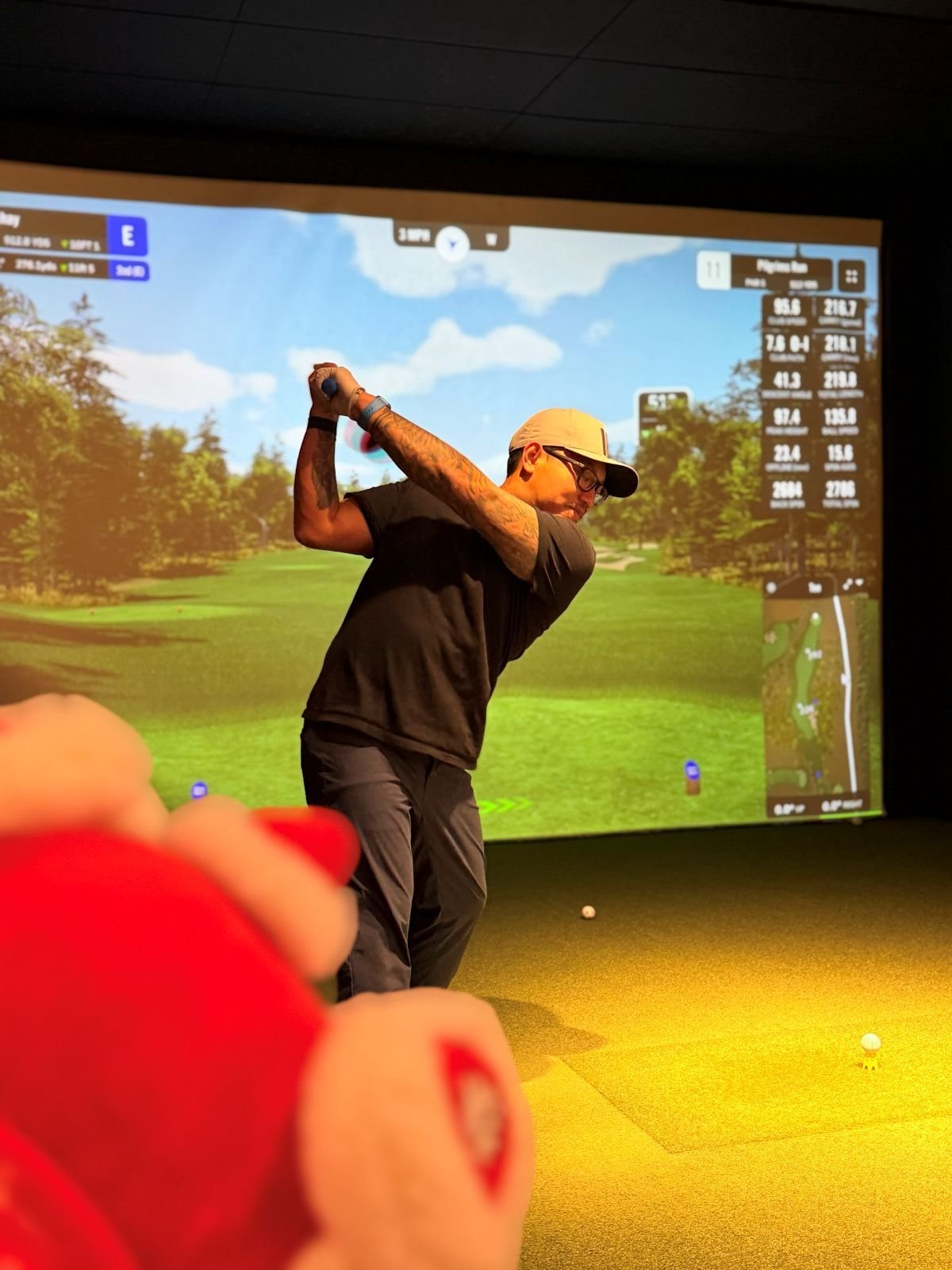League golfer swinging on a simulator during Fall League